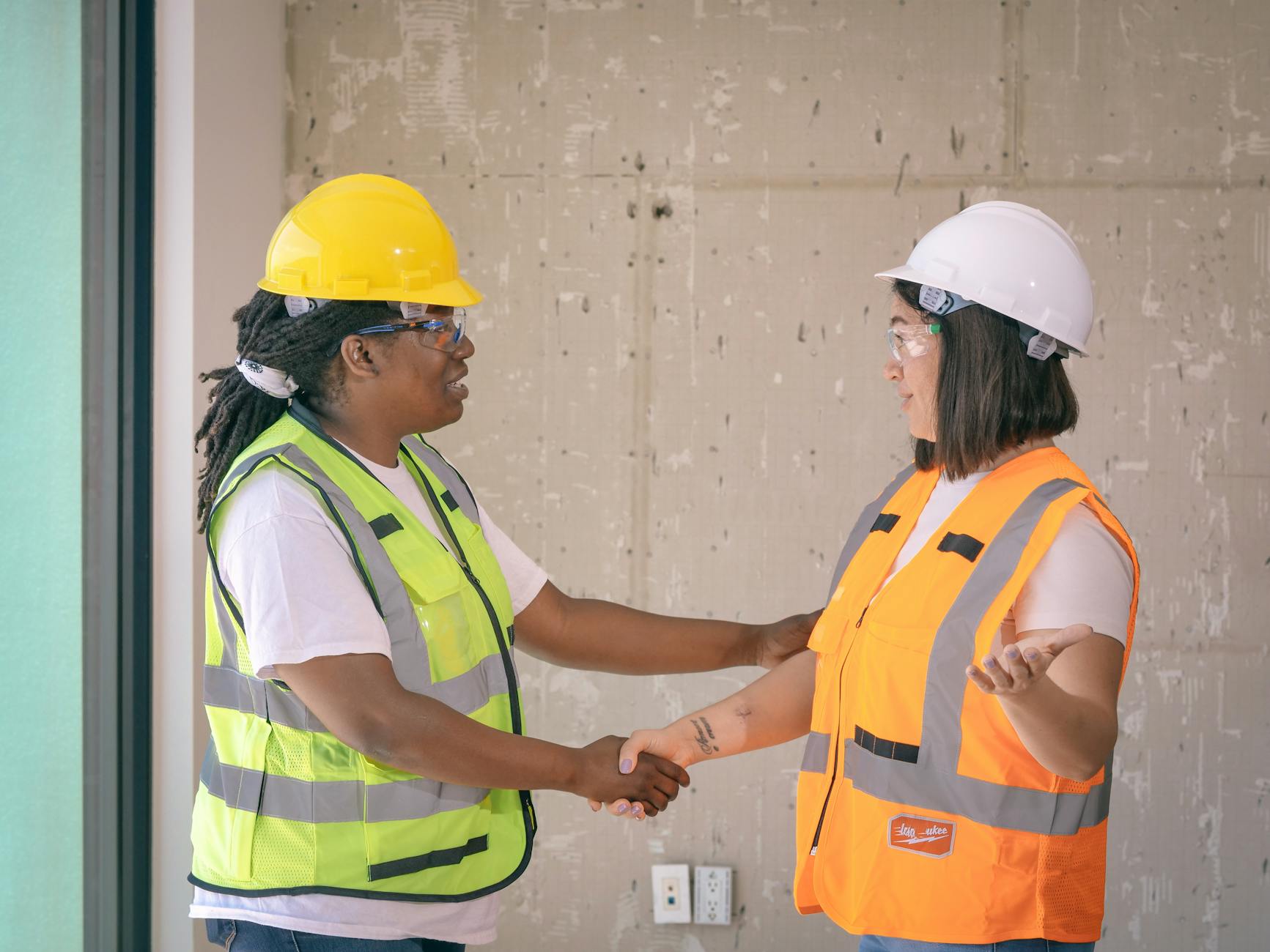 female engineers doing a handshake
